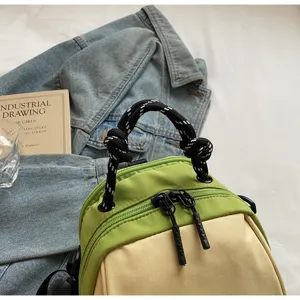 Green beige crossbody bag detail, casual commute shell bag, stylish woven handle design.