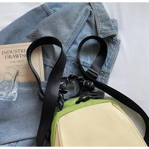 Minimalist colorblock commuter shoulder bag for women, stylish casual messenger bag.