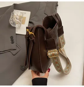 Korean style minimalist brown shoulder bag with wide woven strap for women, chic crossbody.