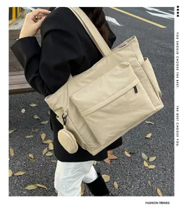 Bolso tote grande de lona beige bolso de hombro informal con bolsillos para uso diario.