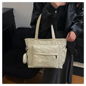 Bolso tote grande beige para mujer, bolso de hombro de nailon casual con bolsillo frontal.