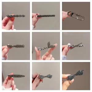 Detailed view of exquisite rhinestone and pearl hair clips, showcasing various chic designs.