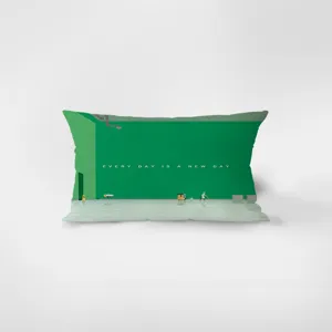 Dettaglio del cuscino rettangolare verde con design di testo stimolante per arredare.