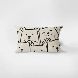 Close-up detail of the cute cartoon bear pattern on the soft rectangular throw pillow.