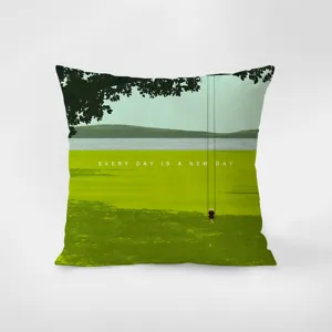 Green velvet throw pillow featuring scenic landscape art and inspirational quote print for sofa.
