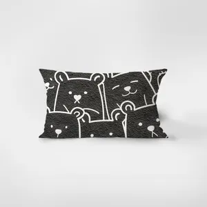 Close-up detail of the rectangular velvet throw pillow featuring a charming smiling bear pattern.
