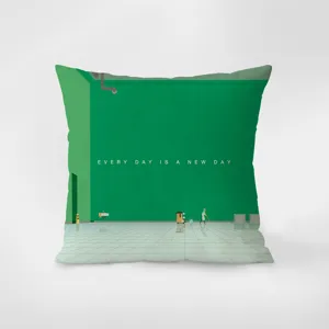 Green velvet throw pillow detail showing modern graphic art print and inspiring quote.
