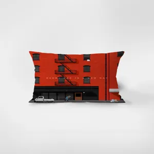 Red building print rectangular lumbar throw pillow detail shot, modern home decor accent.
