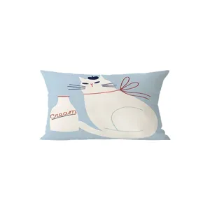 Close-up of decorative throw cushion featuring a cute cat and milk bottle illustration.