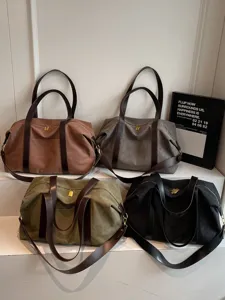 Large capacity canvas travel duffel bag multi color shoulder crossbody bag for women main view