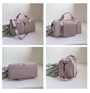 Detail view of large capacity solid color women travel duffel bag yoga shoulder storage bag.