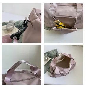 Large capacity travel duffel bag detail, solid color waterproof fabric, shoulder strap & pockets.