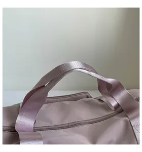 Close up view of durable canvas travel bag strap and smooth zipper detail for daily use gym.