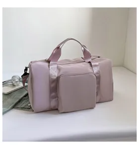 Large capacity travel duffel bag in pink, solid color gym shoulder bag with front pocket.