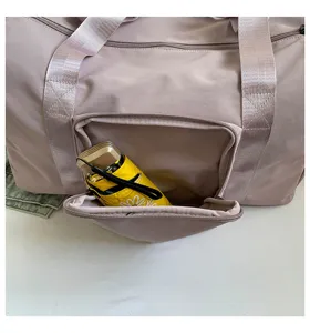 Large capacity travel duffel bag for women, solid color casual shoulder storage yoga bag.