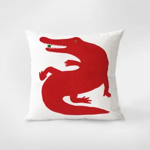 White throw pillow featuring a striking red alligator art print. Modern home decor cushion.