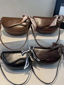 Stylish women saddle shoulder bag with chic silk scarf, versatile PU leather crossbody purse.