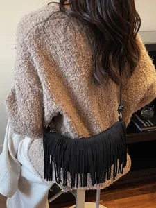 Black fringe crossbody shoulder bag for women, stylish vintage suede handbag with strap.