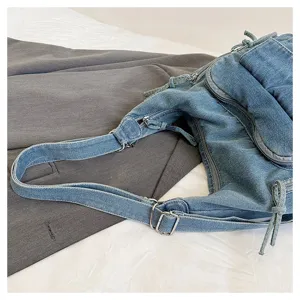 Detailed view of the stylish women's denim shoulder bag featuring adjustable strap and multi-pocket design.