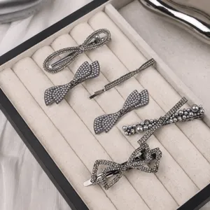 Rhinestone pearl hair clips set, elegant bow hairpins for women and girls daily styling.