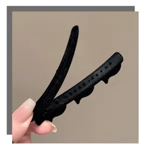 Black flocked hair clip detail showcasing anti-slip teeth design for daily bangs styling.