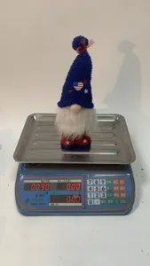 Detailed view of US Independence Day gnome plush doll ornament with blue star hat.