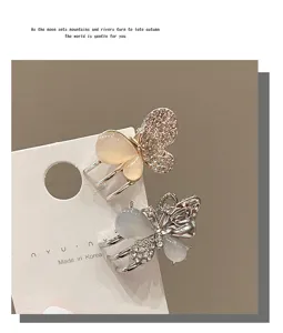Elegant butterfly hair claw clip with rhinestones and opal stones for women chic side bangs styling.