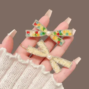 Elegant rhinestone pearl bow hair clip for women, sparkling side hairpin hair accessories.