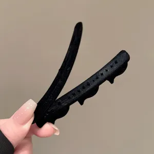 Black flocked duckbill hair clip for bangs and side hair styling, elegant hair accessory.
