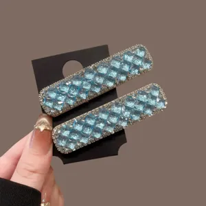 Blue crystal rhinestone hair clips for women, sparkling side snap clips for bangs and styling.
