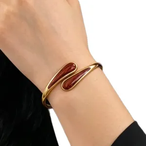 Gold-plated open bangle bracelet with red enamel drops, stylish alloy wrist jewelry for women