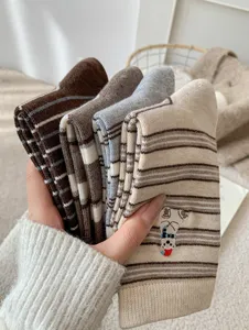 Cozy winter wool socks for women featuring cute polar bear embroidery and retro contrast stripes.