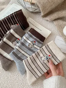 Cozy winter wool socks featuring cute polar bear embroidery and retro striped design warm.