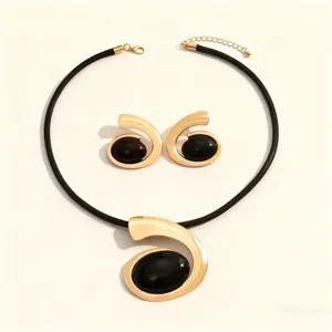 Exquisite fashion geometric spiral pendant necklace and earrings set with black stone detail.