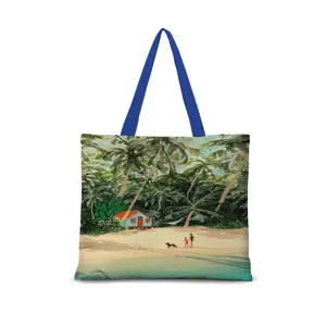 Vue détaillée du sac cabas en toile avec illustration de plage et anses de couleur bleue.