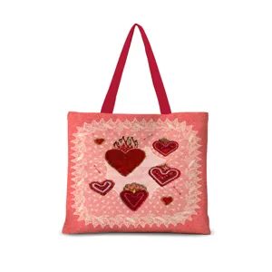 Sac cabas en toile avec motif de coeur sacré et anses rouges pour travail et école.