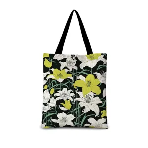 Sac cabas en toile noir avec motif de lys artistiques, idéal pour les déplacements.