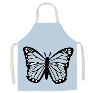 Light blue cotton linen kitchen apron featuring a clear black butterfly graphic detail.
