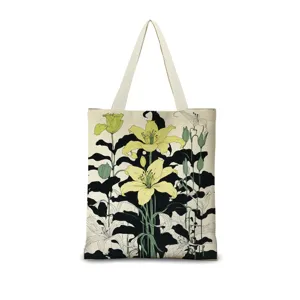 Vue détaillée du sac cabas en toile imprimée avec un motif floral de lys art nouveau.