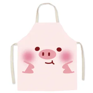 Cute cartoon pig apron detail view, pink kitchen cooking apron with beige straps fabric.
