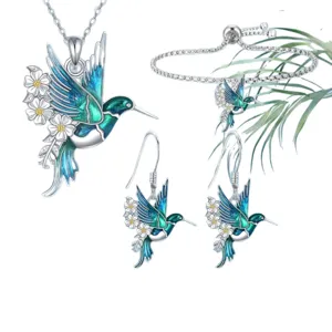 Exquisite hummingbird daisy jewelry set includes necklace, earrings and adjustable bracelet.