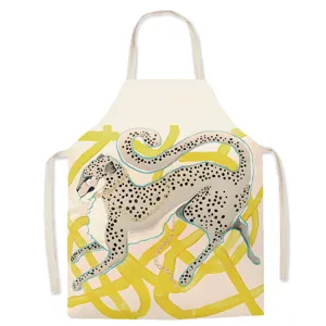 Retro cheetah print detail on vintage style cotton apron, kitchen cooking utility.