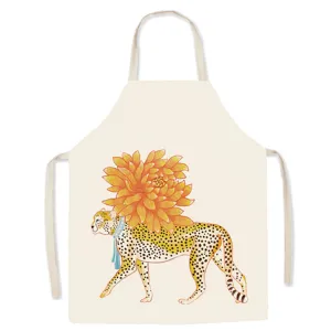 Detailed view of beige cotton canvas apron featuring a retro leopard and flower print.