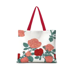 Detailansicht der Vintage-Rosen gedruckten Segeltuchtasche mit rotem Griff und Blumenmuster.