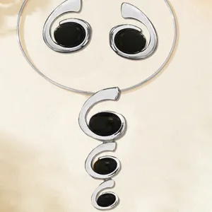 Silver-tone spiral pendant choker necklace and matching earrings jewelry set fashion style.