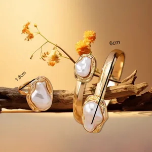 Detail shot of vintage metal baroque faux pearl ring and bracelet set, 1.8cm and 6cm.