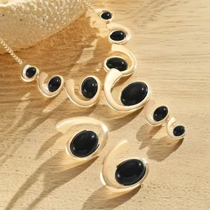 Fashion vintage gold swirl black stone jewelry set with Y-necklace and earrings.
