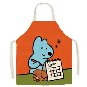 Detailed shot of cute cartoon dog apron featuring a blue bear and calendar print for kitchen use.
