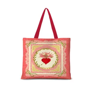 Vue détaillée du sac cabas en toile rose avec motif cœur vintage et anses rouges.
