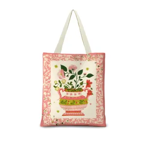 Vue rapprochée du sac cabas en toile avec impression de vase floral vintage et bordure.